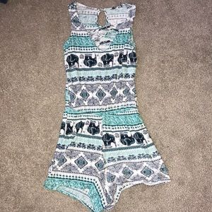 White and blue elephant romper.